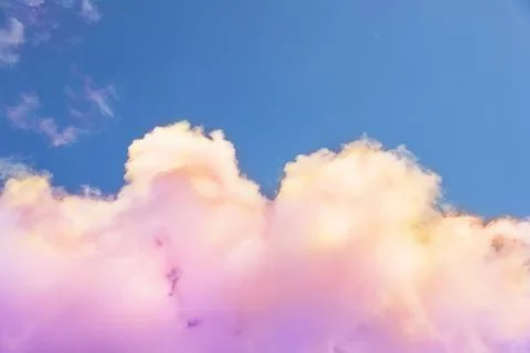 Fluffy color clouds floating in beautiful blue sky Stock Photos