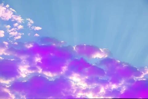 Fluffy color clouds floating in beautiful blue sky Stock Photos