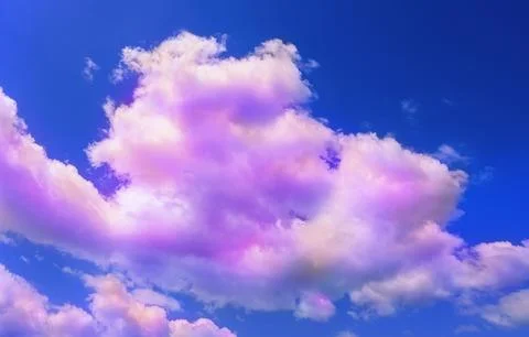 Fluffy color clouds floating in beautiful blue sky Stock Photos
