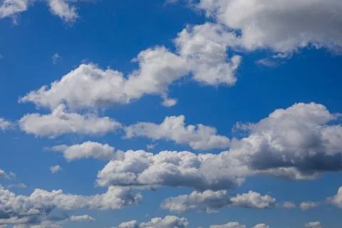 Fluffy cummulus clouds Stock Photos