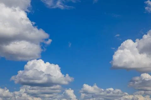 Fluffy cummulus clouds Stock Photos