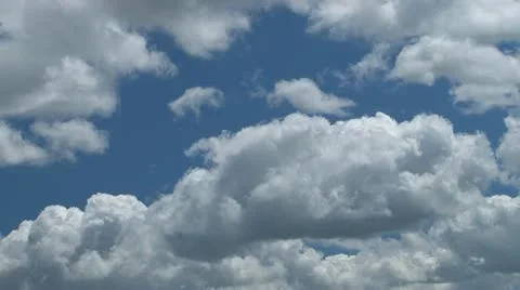 Fluffy cumulus clouds against light blue sky 動画素材 10862054