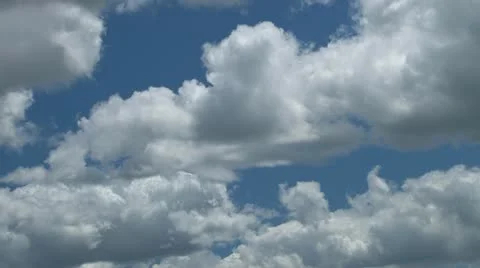 Fluffy cumulus clouds against light blue sky Stock-Footage 10862147