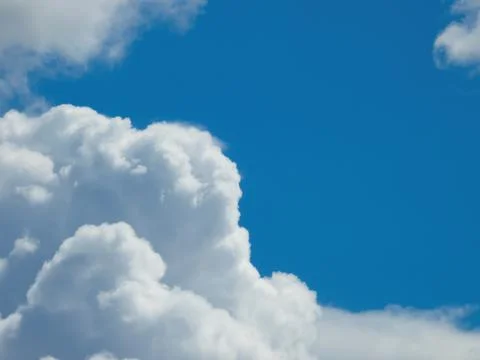 Fluffy cumulus clouds Stock Photos