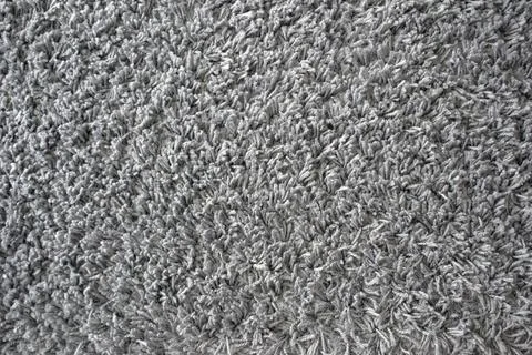 Fluffy grey carpet. Grey texture background Stock Photos