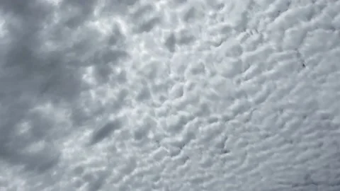 Fluffy grey clouds fill the sky - time lapse Stock Footage 149213898