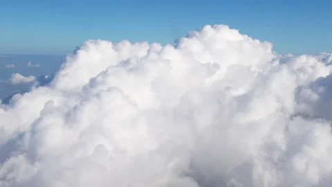 Fluffy nimbocumulus clouds from above during a flight 스톡 동영상 310191345