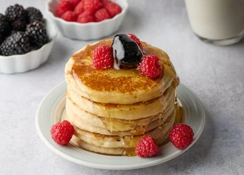 Fluffy Pancake Stack with Berries and Syrup Stock Photos