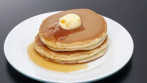 Fluffy pancake stack with melting butter and syrup, zoom pan Stock Footage 337352350