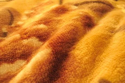 Fluffy piled waved fabrics texture. Abstract orange brown nappy background Stock-Fotos