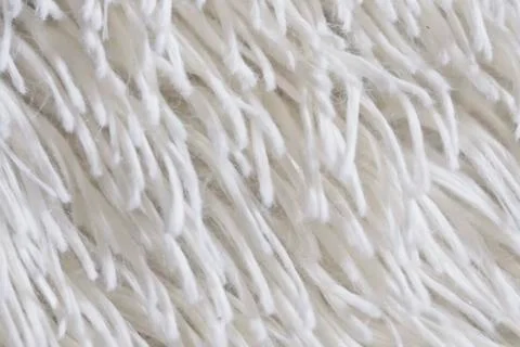 Fluffy plaid of polyester with a long heap gray. Comfortable home textiles. B Stock Photos