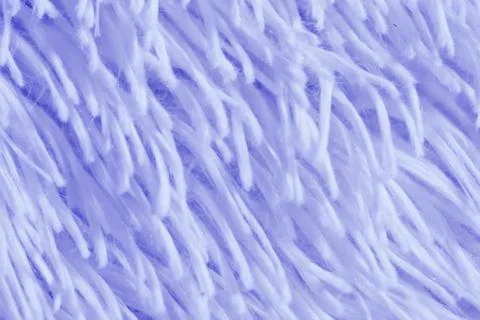 Fluffy plaid of polyester with a long heap gray. Comfortable home textiles Stock Photos