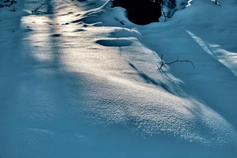 Fluffy snow in the rays of the low winter sun - beautiful winter mountain lan Stock Photos