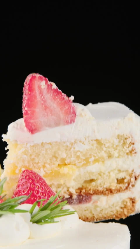 Fluffy strawberry cake on black background, close up Video stock 302881359