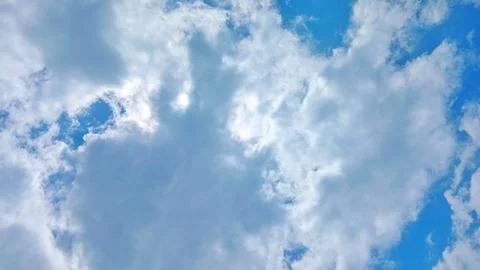 Fluffy Thick Cumulus Clouds Over Rural Village Landscape at Daytime Stock-Fotos