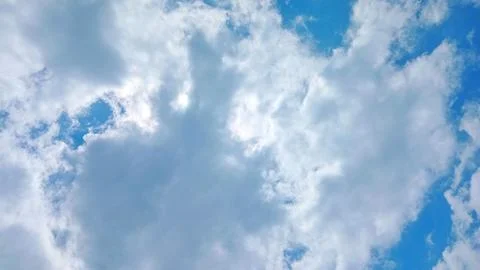 Fluffy Thick Cumulus Clouds Over Rural Village Landscape at Daytime Stock-Fotos