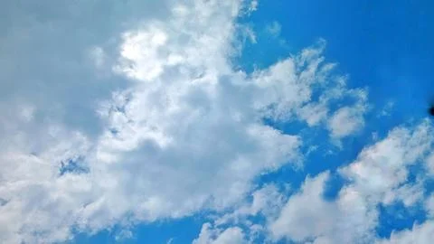 Fluffy Thick Cumulus Clouds Over Rural Village Landscape at Daytime Stock-Fotos