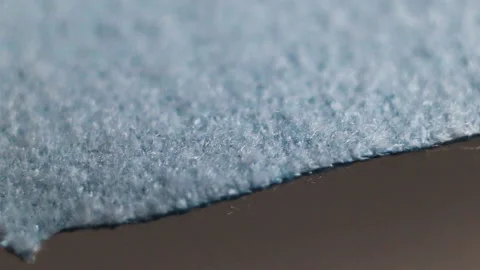 Fluffy very dense thin blue unnatural material made of microfiber fiber. Real ti Stock Footage 129148125