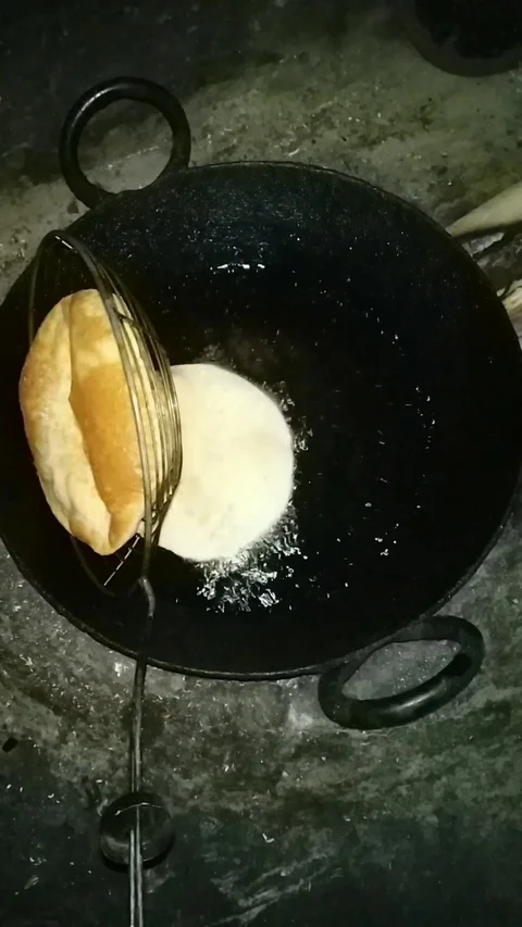 Fluffy wheat poori Stock Footage 126419894