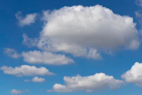 Fluffy white cloud formation in a beautiful blue sky Stock Photos