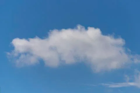 Fluffy white cloud formation in a beautiful blue sky Stock Photos