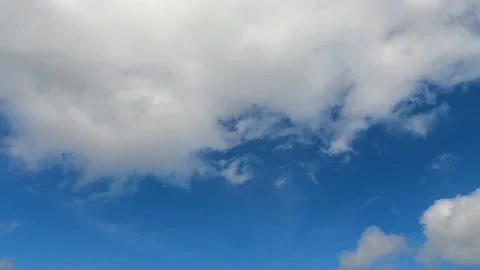 Fluffy white cloud n wispy moon on sunny clear blue sky Video stock 158879480