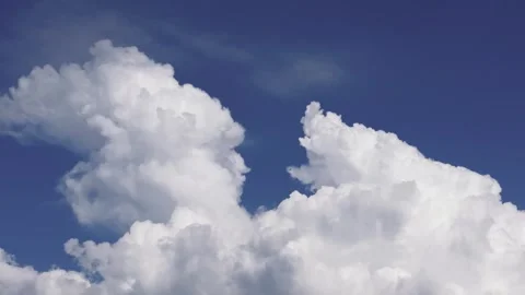 Fluffy White Clouds Against Blue Sky. Low Angle Shot Stock Footage 277530985