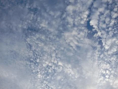 Fluffy White Clouds Against Blue Sky Background Stock Photos