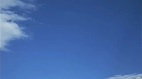 Fluffy white clouds and blue sky - HD Timelapse Stock Footage 10922002