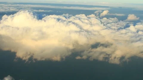 Fluffy white clouds and blue sky view from airplane Stock Footage 40030044