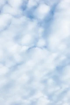 Fluffy White Clouds in a Blue Sky Stock-Fotos