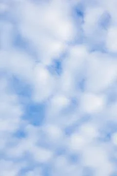 Fluffy White Clouds in a Blue Sky Fotos Stock