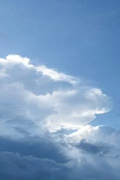 Fluffy White Clouds in a Blue Sky Stock Photos