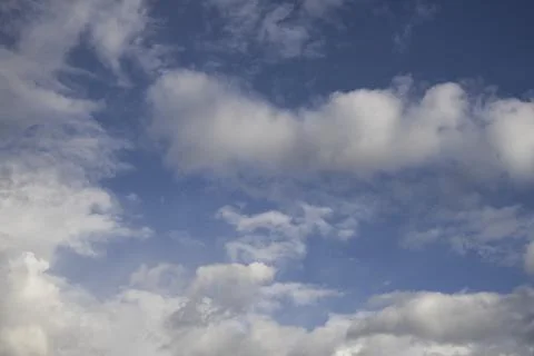 Fluffy White Clouds in Blue Sky, Beautiful Cloudscape Background. Photos