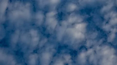 Fluffy White Clouds in Blue Sky Фото