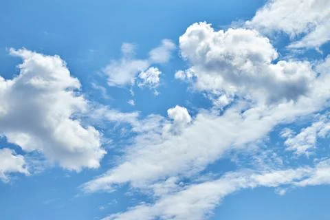 Fluffy white clouds in blue sky. Cumulus cloudscape texture. Sunny summer s.. 写真素材