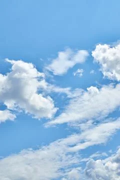 Fluffy white clouds in blue sky. Cumulus cloudscape texture. Sunny summer s.. 写真素材
