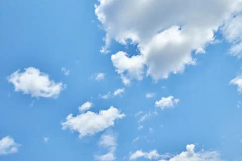 Fluffy white clouds in blue sky. Cumulus cloudscape texture. Sunny summer s.. Stock Photos