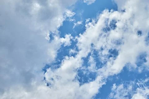 Fluffy white clouds in blue sky. Cumulus cloudscape texture. Sunny summer s.. 写真素材