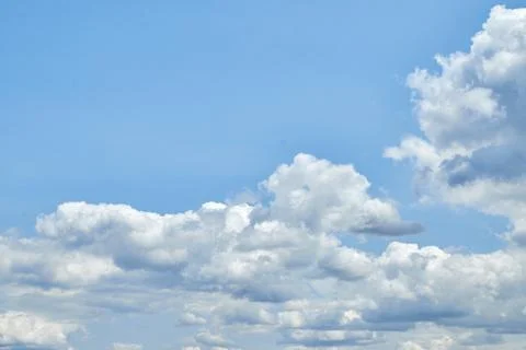 Fluffy white clouds in blue sky. Cumulus cloudscape texture. Sunny summer s.. 写真素材