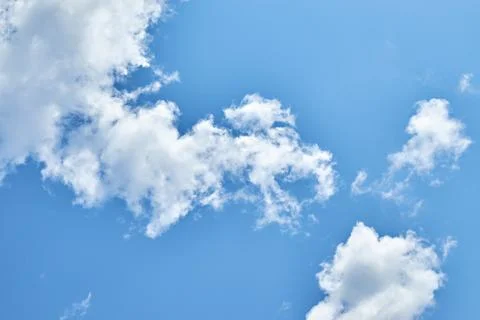 Fluffy white clouds in blue sky. Cumulus cloudscape texture. Sunny summer s.. Stock Photos