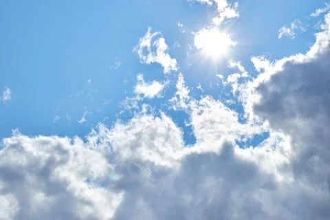 Fluffy white clouds in blue sky. Cumulus cloudscape texture. Sunny summer s.. Stock Photos