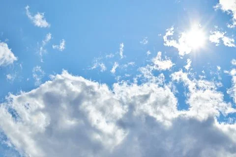 Fluffy white clouds in blue sky. Cumulus cloudscape texture. Sunny summer s.. Stock Photos