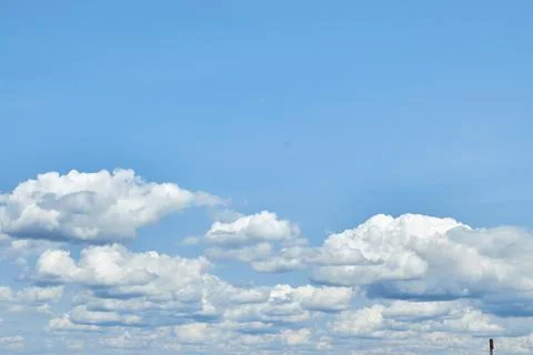 Fluffy white clouds in blue sky. Cumulus cloudscape texture. Sunny summer s.. Stock Photos