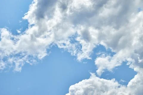 Fluffy white clouds in blue sky. Cumulus cloudscape texture. Sunny summer s.. 写真素材
