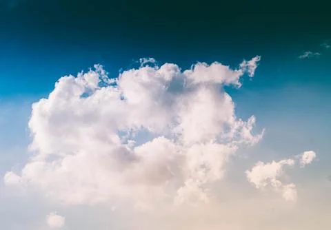 Fluffy White Clouds In A Blue Sky . Stock Photos