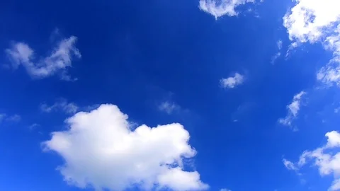Fluffy White Clouds on Deep Blue Sky Time Lapse Stock Footage 109397445
