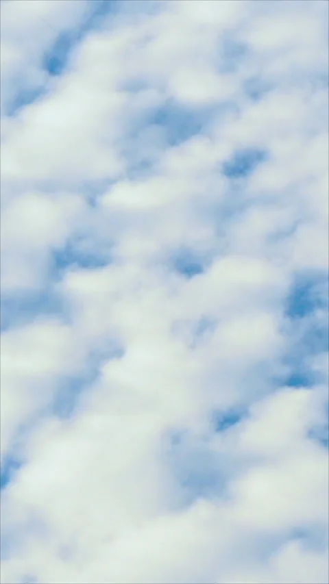 Fluffy White Clouds Drifting Across A Blue Sky. Vertical. 스톡 동영상 276179690