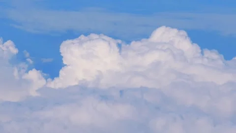 Fluffy white clouds floating in the sky in slow motion 60fps Stock Footage 290094321