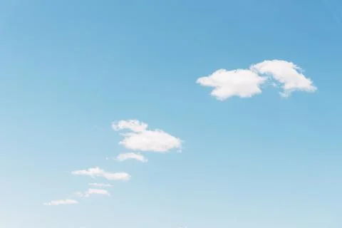 Fluffy white clouds light blue sky, clean Stock Photos